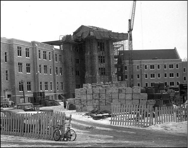 This picture from 1957 shows stacks of cut blocks of Whirlpool Sandstone being used to construct Middlesex College.